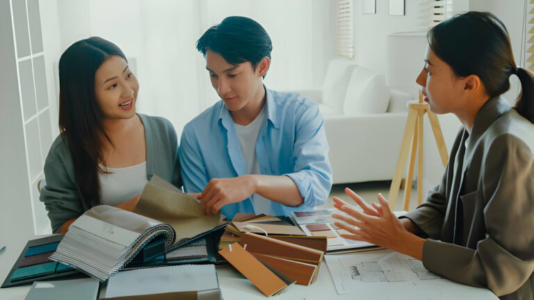 Interior Designer and Couple looking at samples