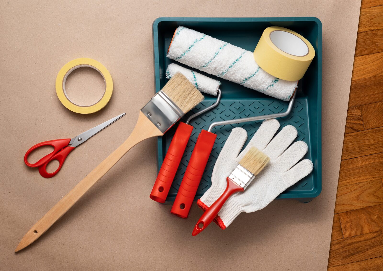 Deck painting tools and supplies are neatly arranged, showcasing essential equipment needed to paint a deck effectively.