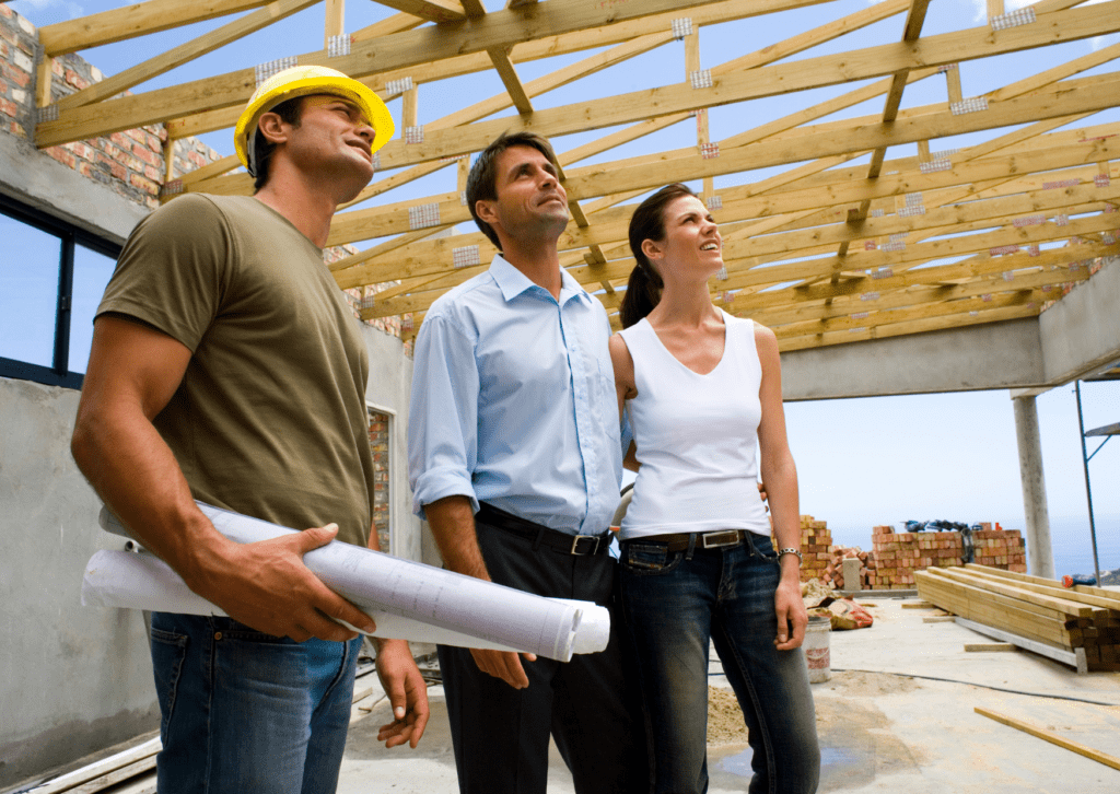 Team inspecting roof framework. Get a free estimate on roof services today.