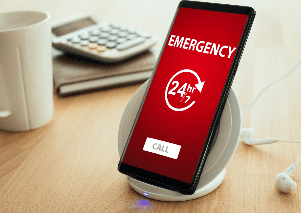 Smartphone displaying a 24/7 emergency call service, illustrating availability for urgent repairs or immediate assistance.