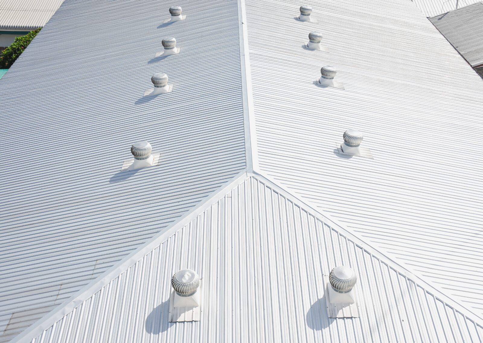 Metal roofs showcase proper ventilation, highlighting the importance of preventative maintenance for commercial roofs.