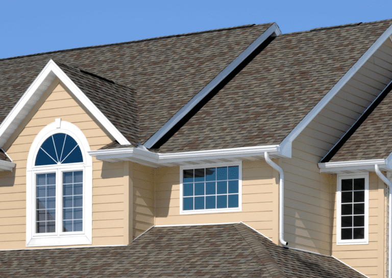 Modern home showcasing quality shingles, gutters, and expert craftsmanship in residential roofing services.